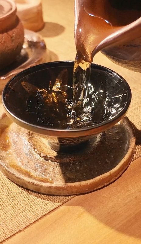 Handmade lacquer and ceramic tea ware in a quiet uncluttered space