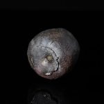 red fire-mark texture on purple clay cup