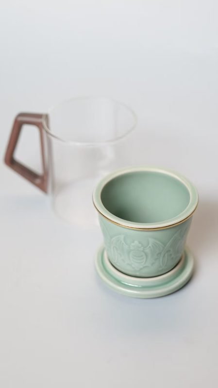 Chinese five bats symbol Yaozhou celadon tea infuser detail