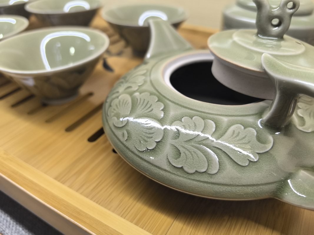 Traditional Chinese Yaozhou celadon tea set in use