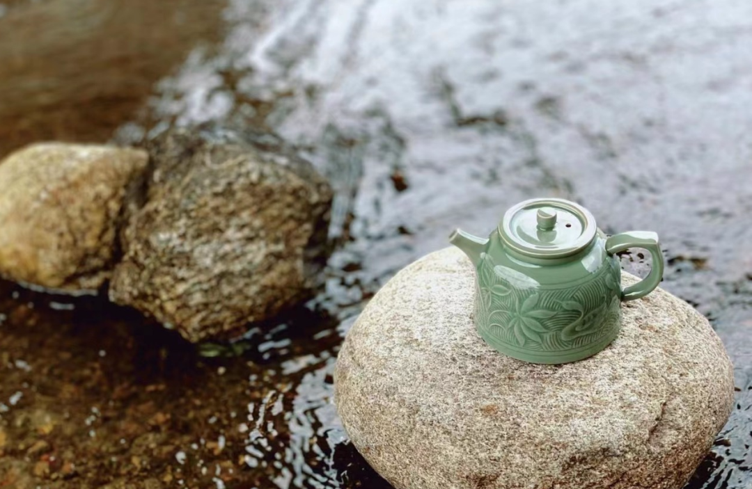 Traditional Chinese Yaozhou celadon tea set in use