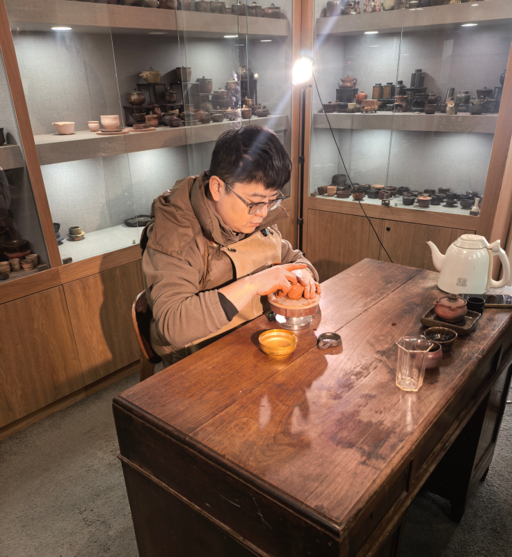Artisan creating handmade Chinese crafts showing human skill, patience, and connection with materials