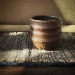 Handmade lacquer tea ware in a calm minimalist interior