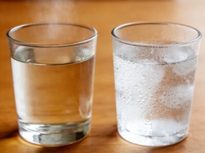 comparison between iced water and hot tea showing different drinking habits
