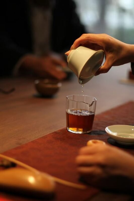 Quiet tea corner with handmade tea ware beside a window