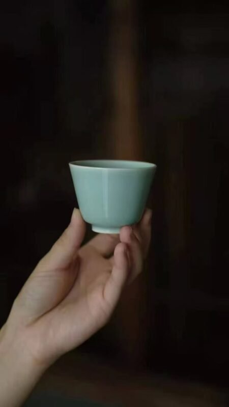 holding a handmade tea cup enhancing the daily tea drinking experience