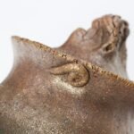 Sculptural Lid Detail Asymmetrical Yet Balanced