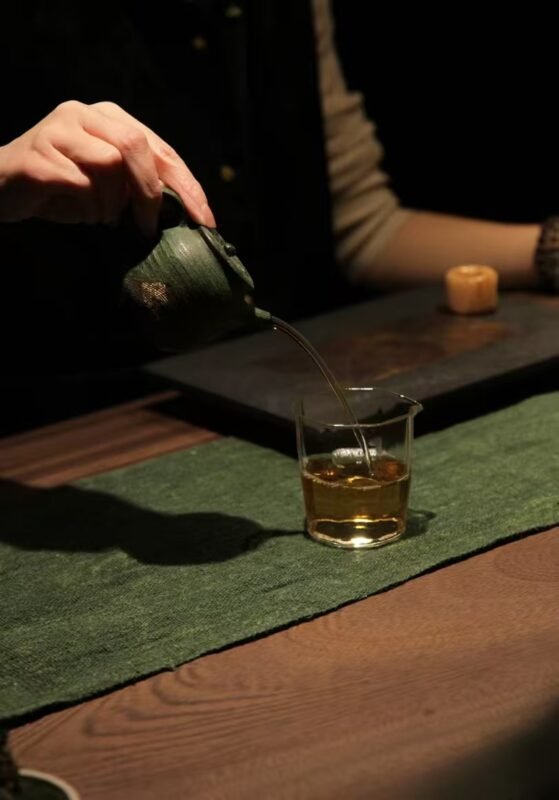 Handmade tea ware arranged on a quiet wooden tea table