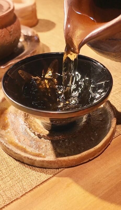 Handmade lacquer tea ware in a calm social tea setting
