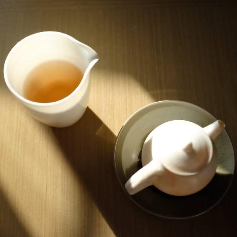 Morning light falling across handmade tea ware