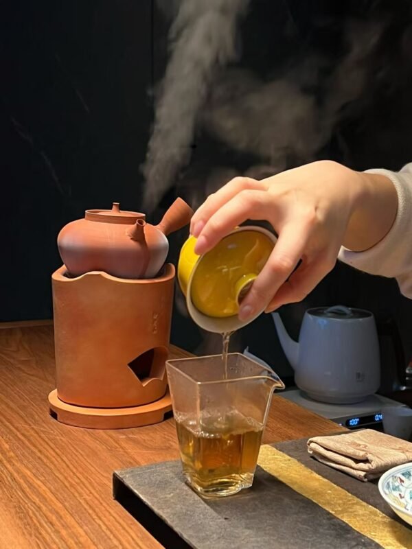 Steam rising from tea in a quiet tea setting