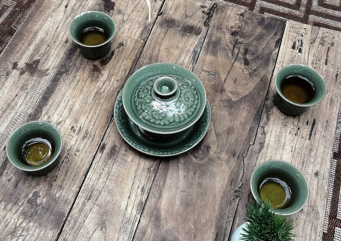 Assorted celadon tea bowls showing glaze textures and calm atmosphere