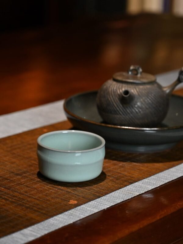 Close detail of soft glaze texture on a handmade tea cup