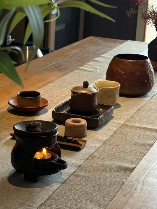 Different tea materials reflecting Five Element emotional states through texture and atmospheric lighting