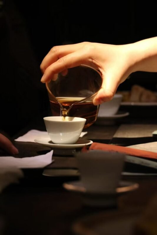 Repetitive tea preparation gestures showing depth of attention through daily structured ritual
