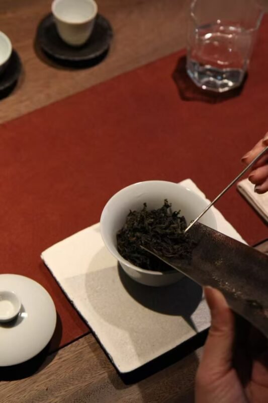 Detailed tea preparation process showing mindful attention and appreciation of simple actions
