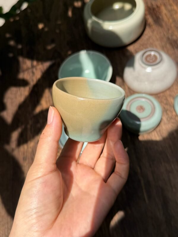 Handmade ceramic tea cup in a quiet natural setting showing the warmth of artisan pottery