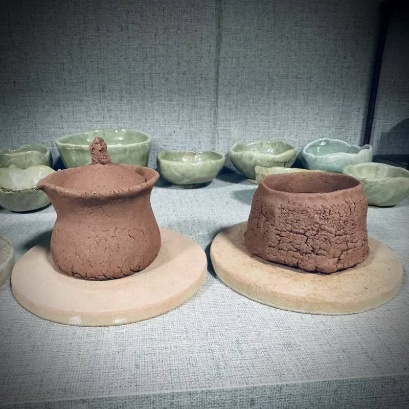 Ceramic artisan shaping a hand-kneaded clay vessel by hand before firing