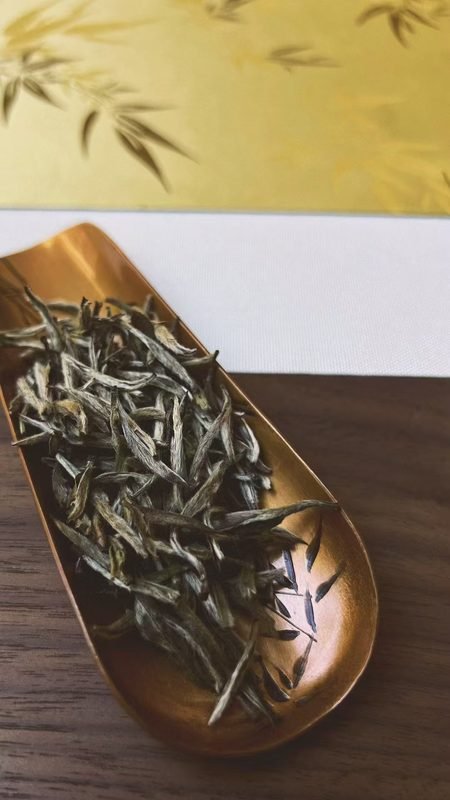 Different loose-leaf tea varieties showing variations in leaf shape, size, and color